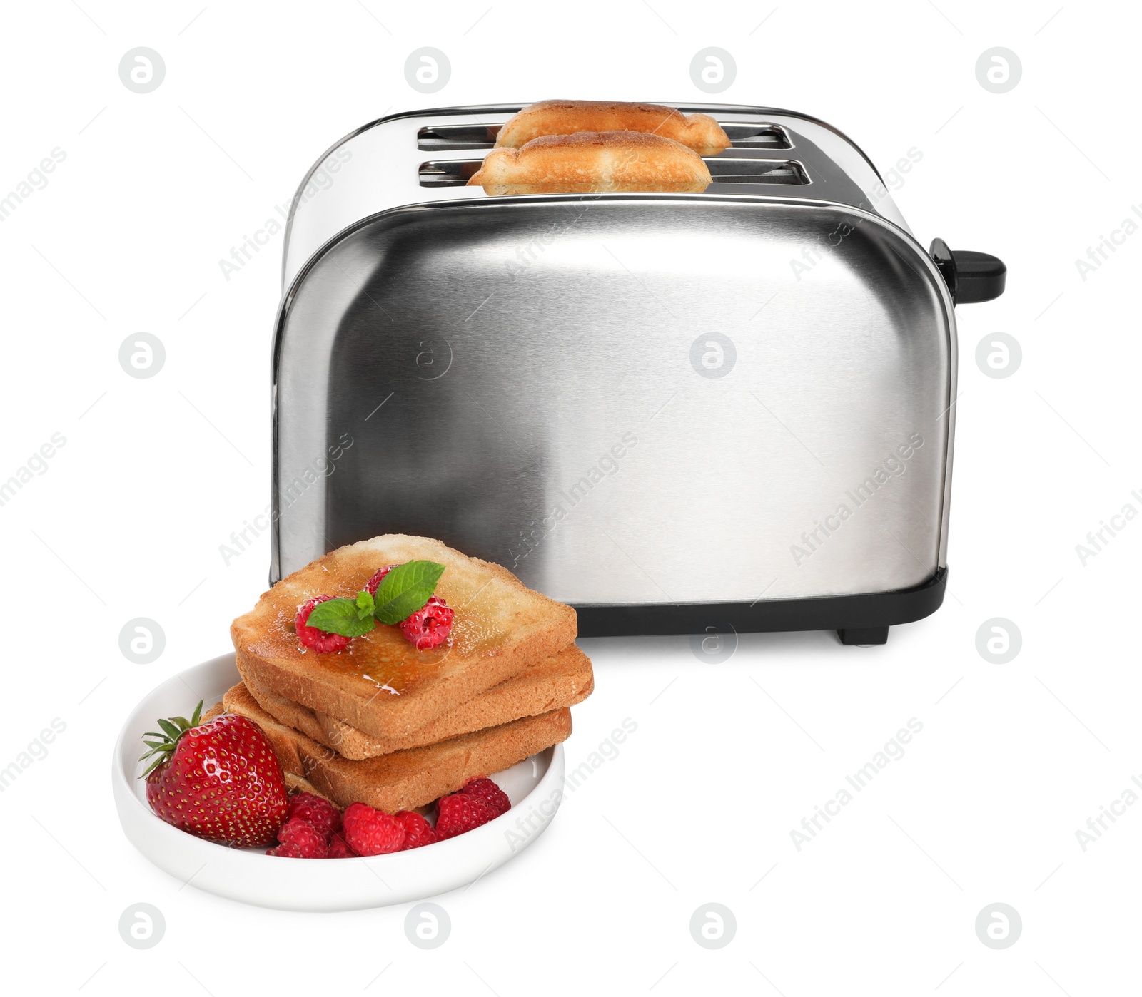 Photo of Toaster with roasted bread and berries on white background