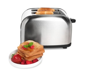 Photo of Toaster with roasted bread and berries on white background