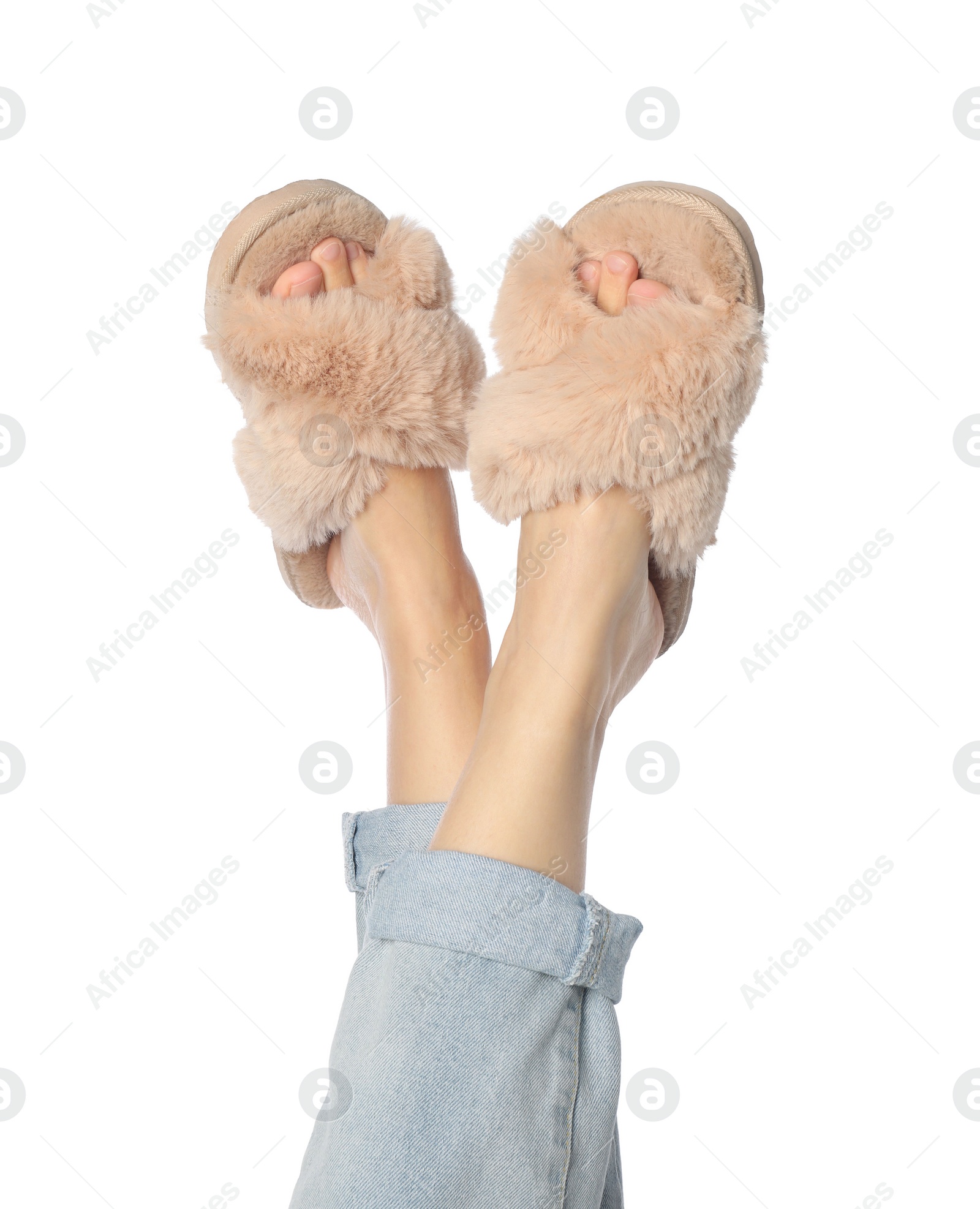 Photo of Woman in beige fluffy slippers on white background, closeup