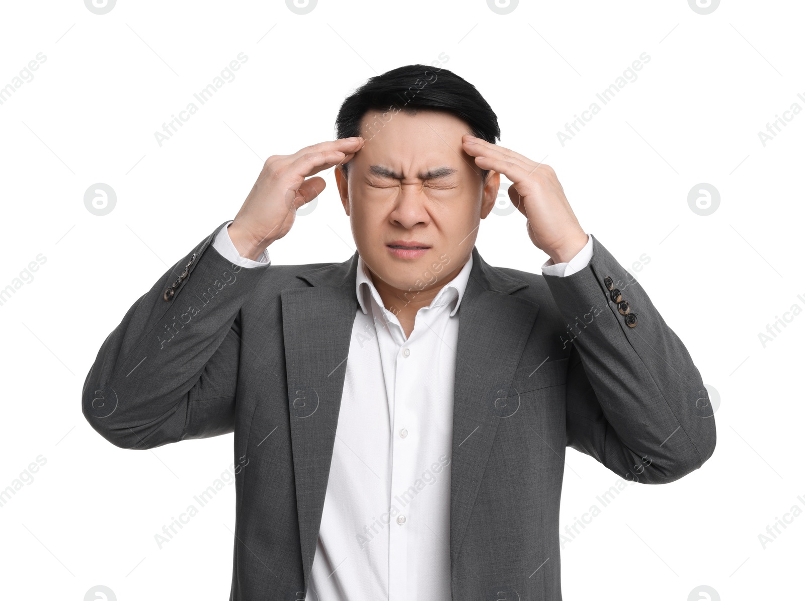 Photo of Tired businessman in suit suffering from headache on white background