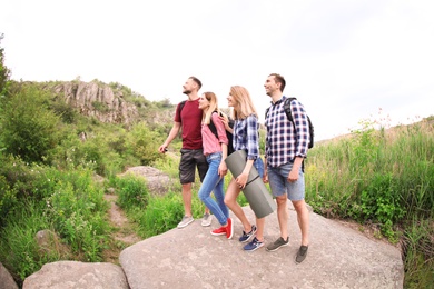 Photo of Group of young people in wilderness. Camping season