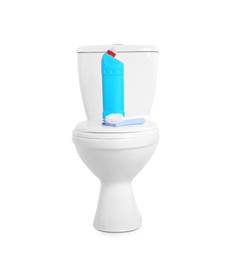 Toilet bowl and cleaning supplies on white background