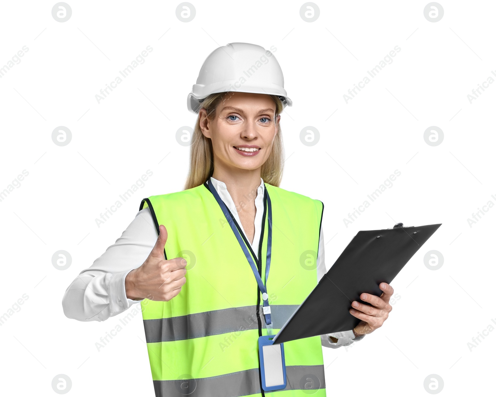 Photo of Engineer in hard hat holding clipboard and showing thumb up on white background