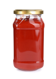 Photo of Tasty tomato sauce in glass jar isolated on white