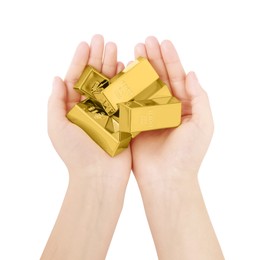 Woman holding shiny gold bars on white background, top view