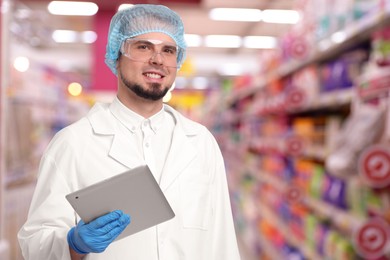 Image of Food quality control specialist examining products in supermarket