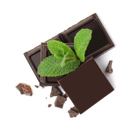 Tasty dark chocolate pieces with mint on white background, top view