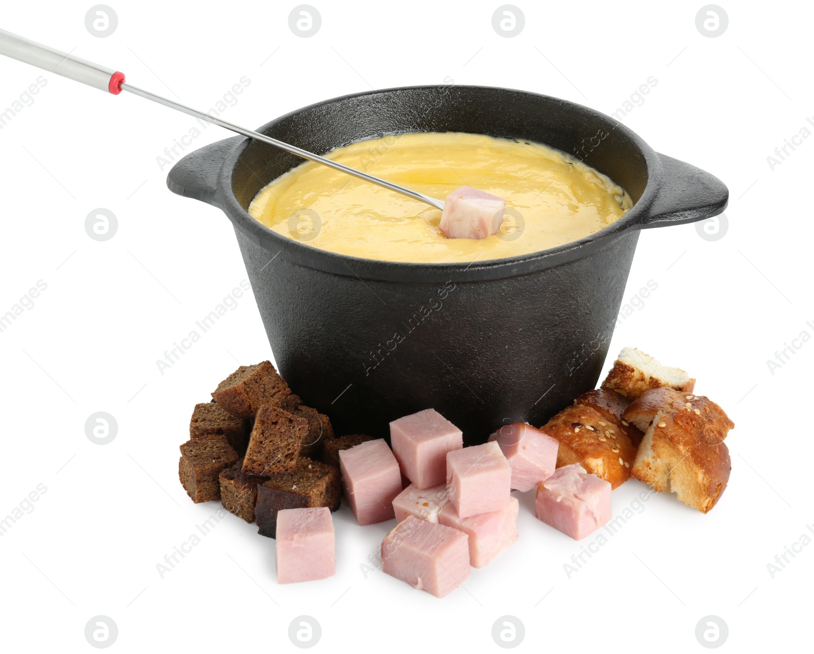 Photo of Fondue with tasty melted cheese, fork, pieces of bread and ham isolated on white
