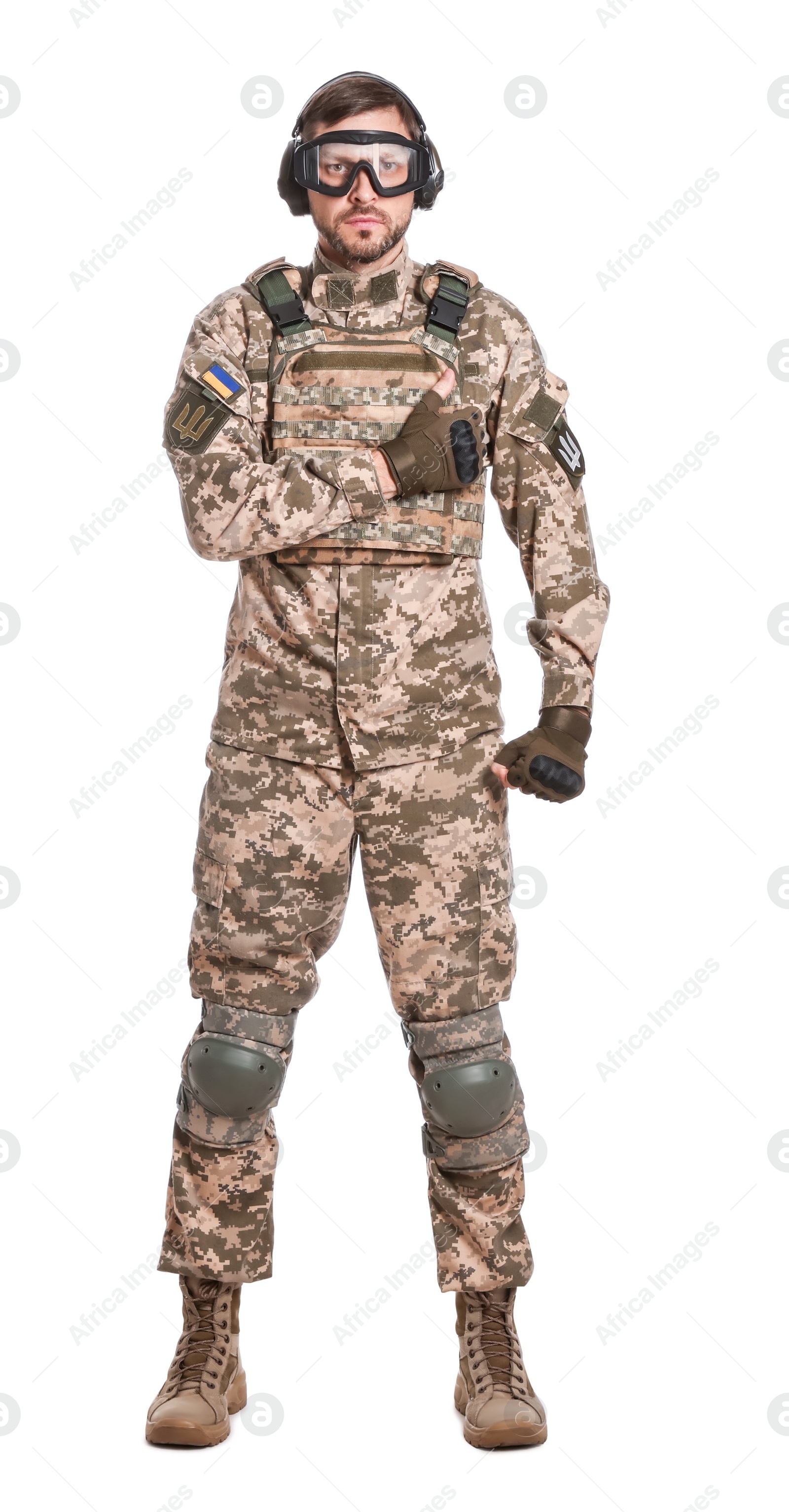 Photo of Soldier in Ukrainian military uniform, tactical goggles and headphones on white background