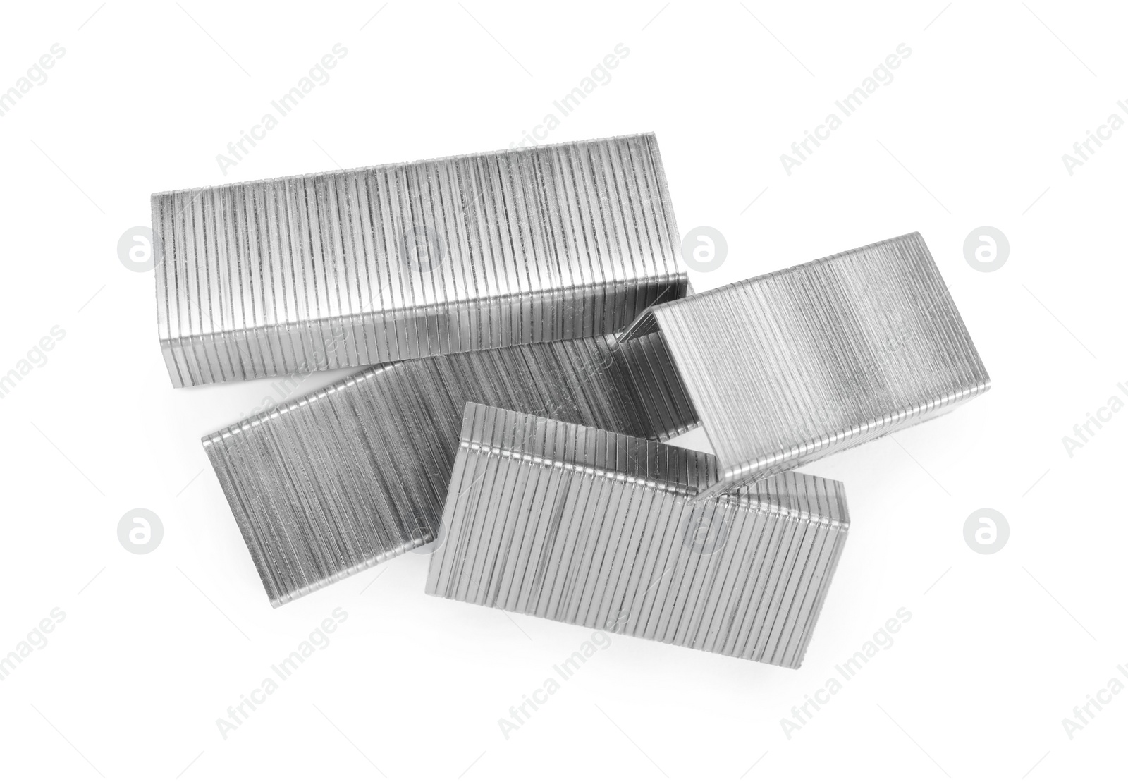 Photo of Many staple gun refills isolated on white, top view