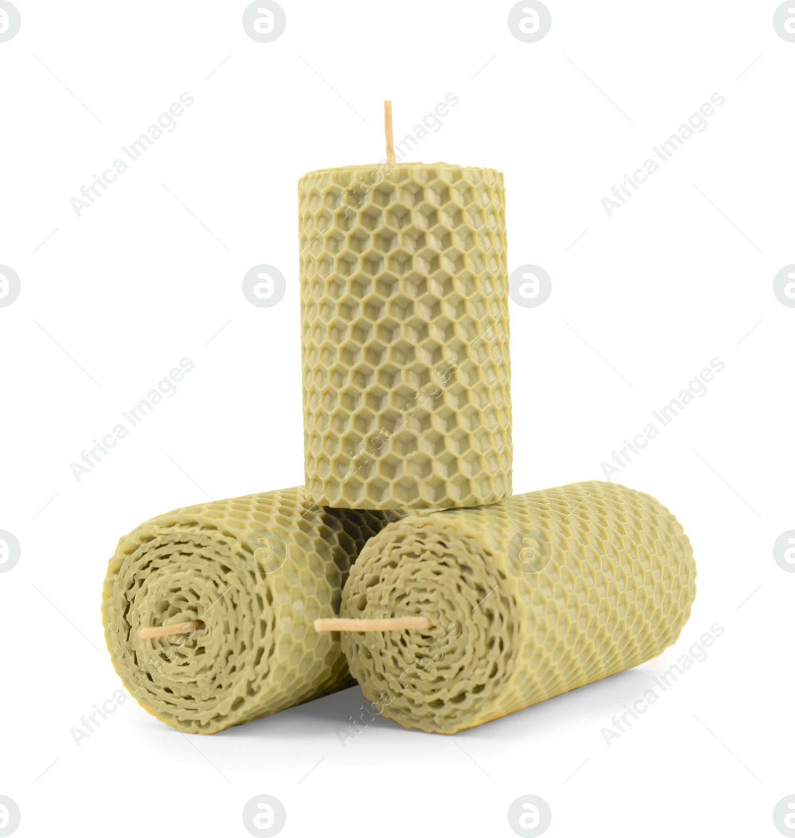 Photo of Stylish elegant beeswax candles isolated on white