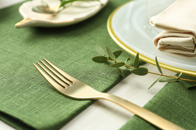 Photo of Stylish tableware with leaves on table. Festive setting