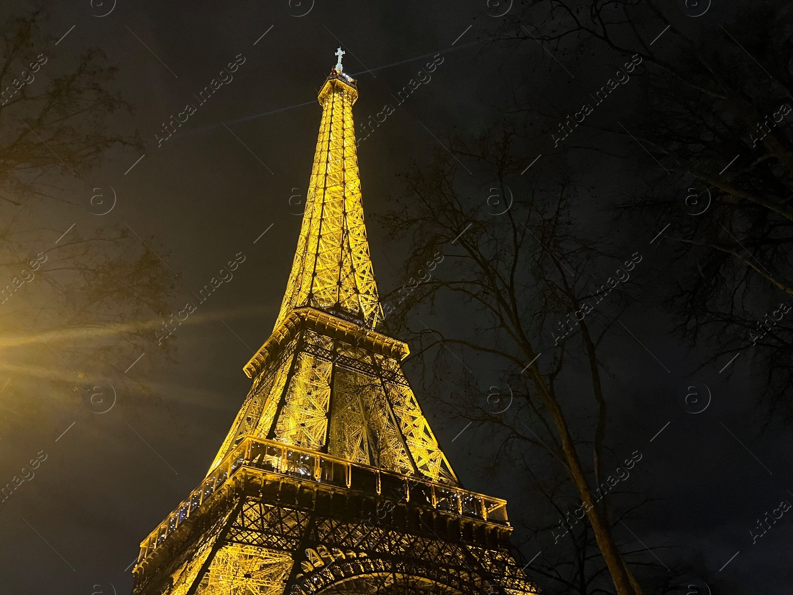 Photo of Beautiful illuminated Eiffel tower against night sky, low angle view