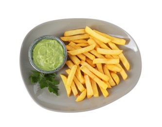Plate with delicious french fries, avocado dip and parsley isolated on white, top view