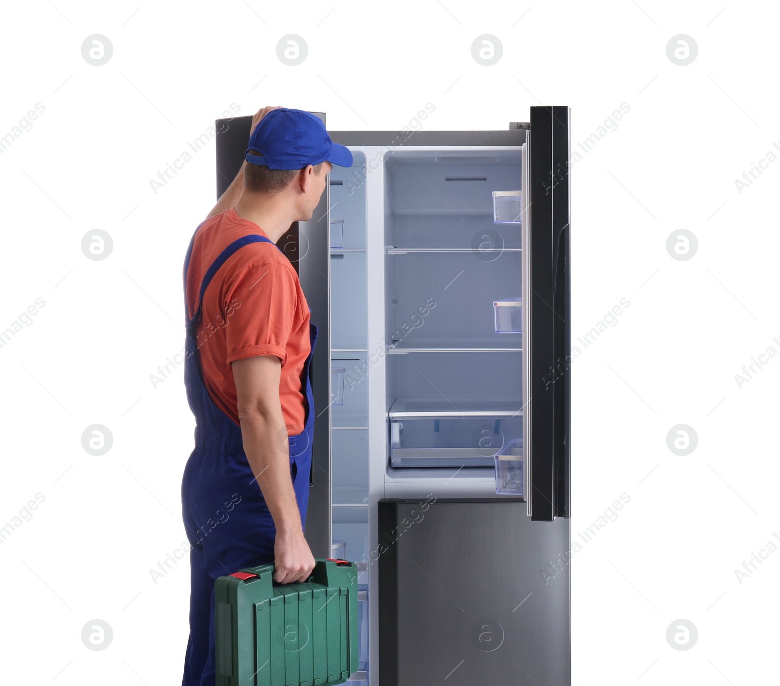 Photo of Male technician with tool box near refrigerator on white background