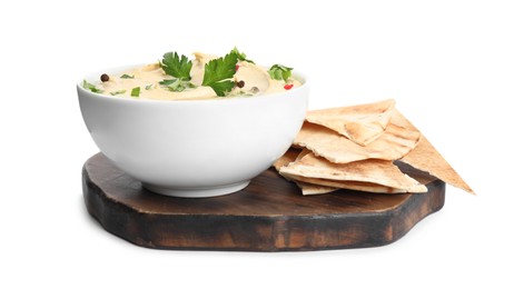 Photo of Delicious hummus with parsley and pita chips on white background