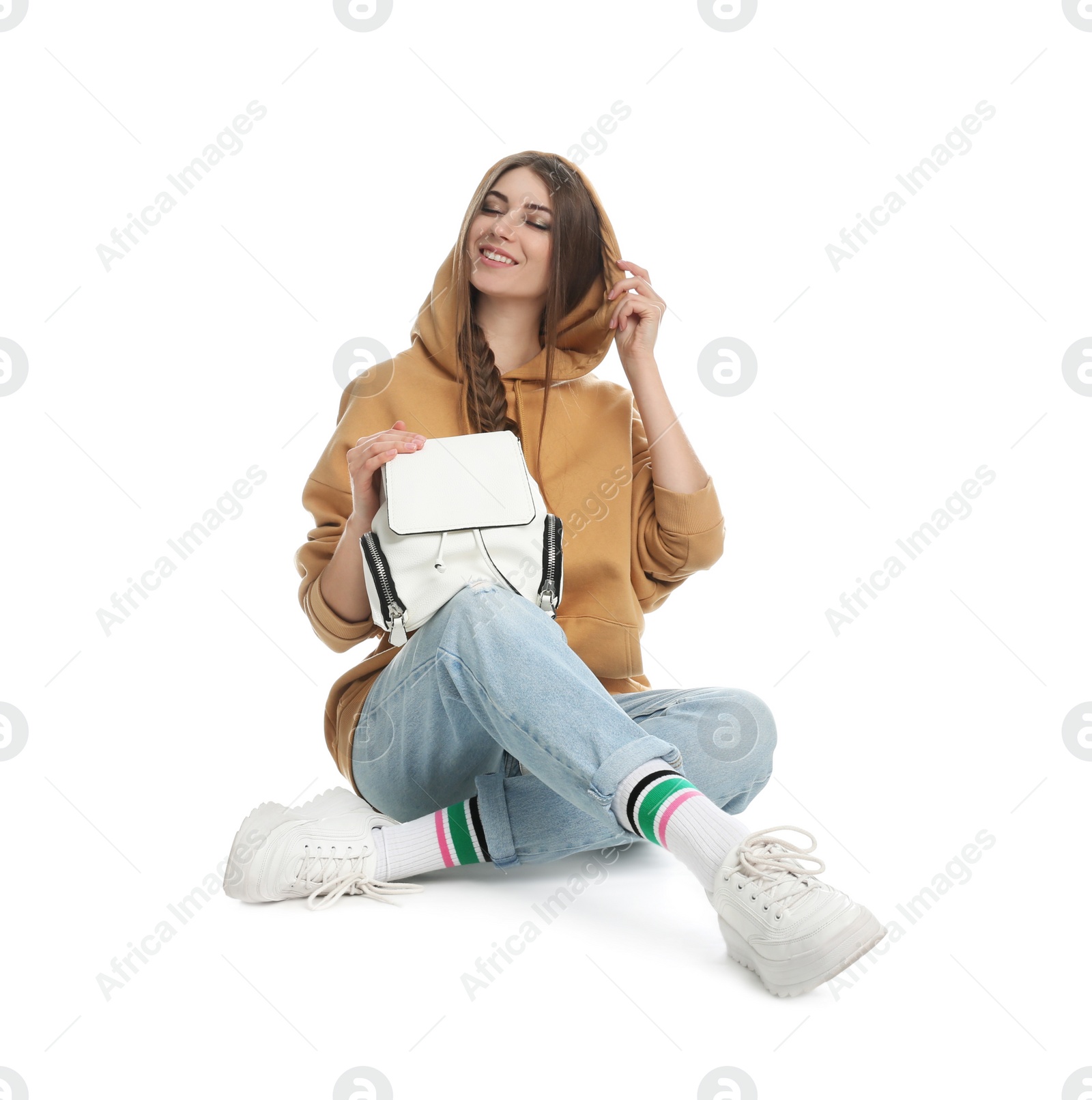 Photo of Beautiful young woman in casual outfit with stylish bag on white background