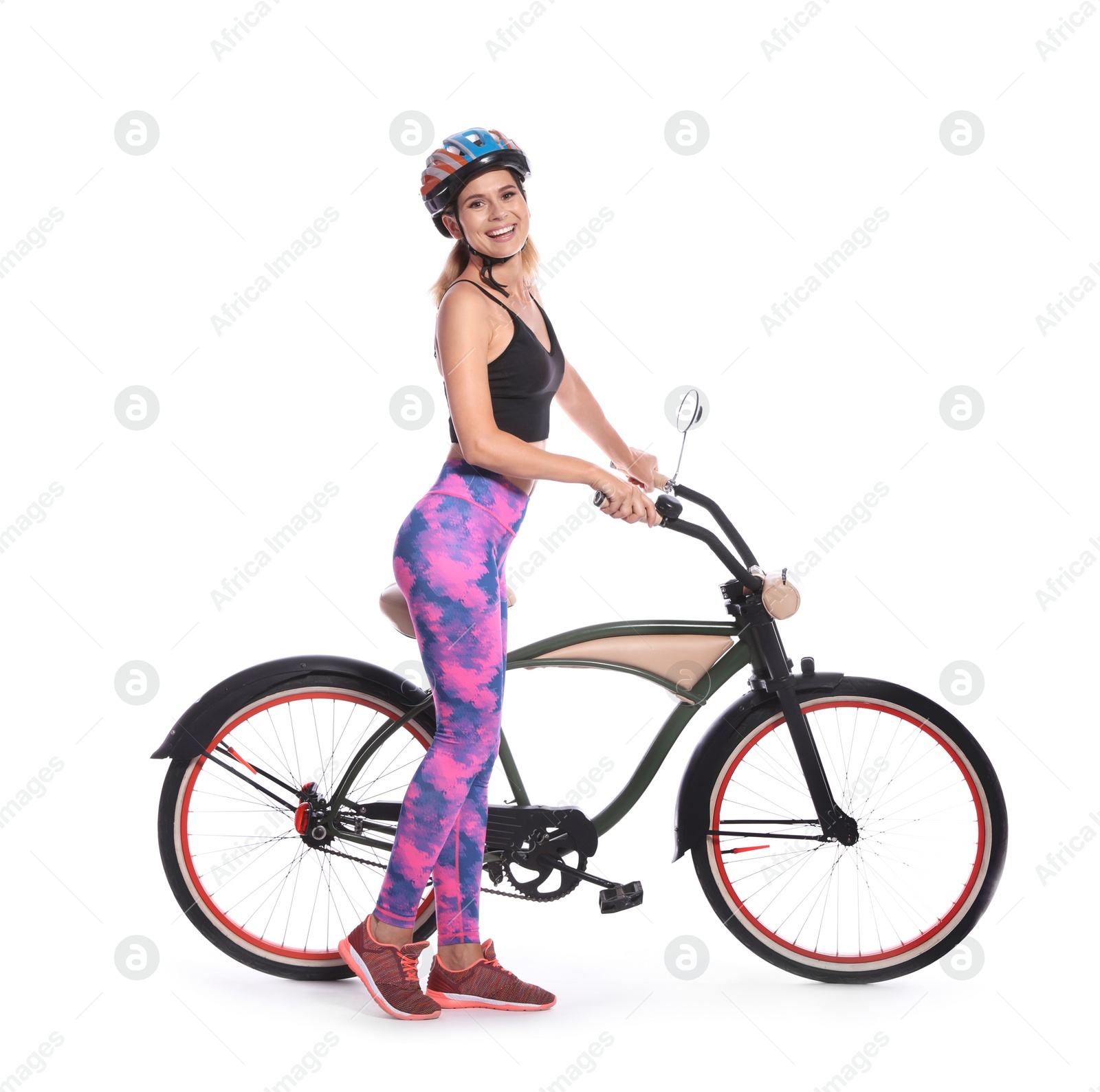 Photo of Portrait of sporty woman with bicycle on white background