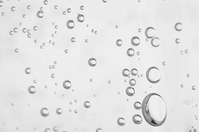 Photo of Soda water with bubbles of gas, closeup
