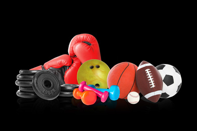 Set of different sport equipment on black background