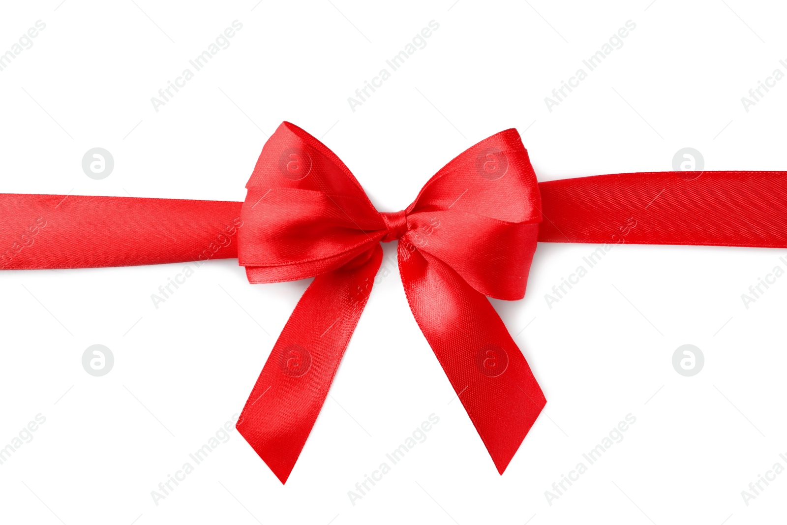 Photo of Red bow and ribbon on white background, top view