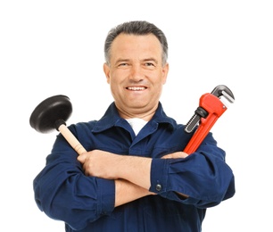 Mature plumber with pipe wrench and force cup on white background