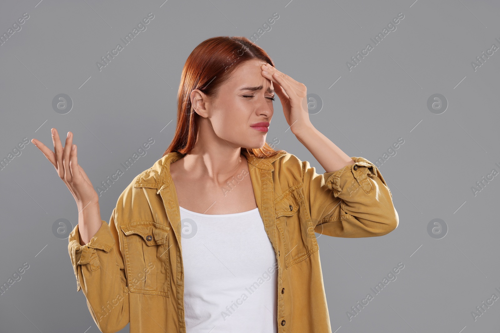 Photo of Casting call. Emotional woman performing on grey background