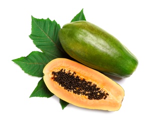 Photo of Fresh juicy ripe papayas with leaf on white background, top view