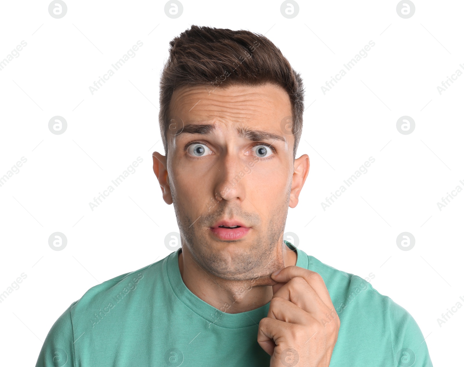 Photo of Emotional young man with double chin on white background