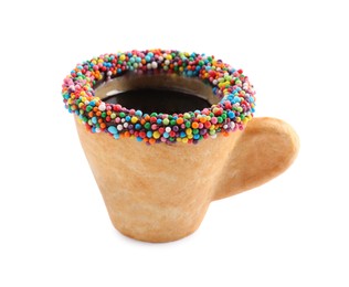 Photo of Delicious edible biscuit cup of coffee decorated with sprinkles isolated on white