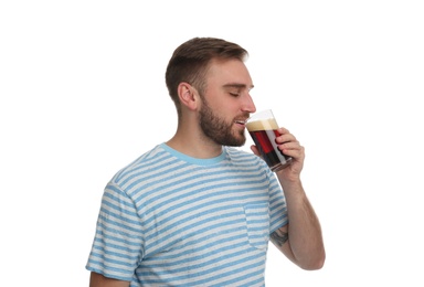 Photo of Handsome man with cold kvass on white background. Traditional Russian summer drink