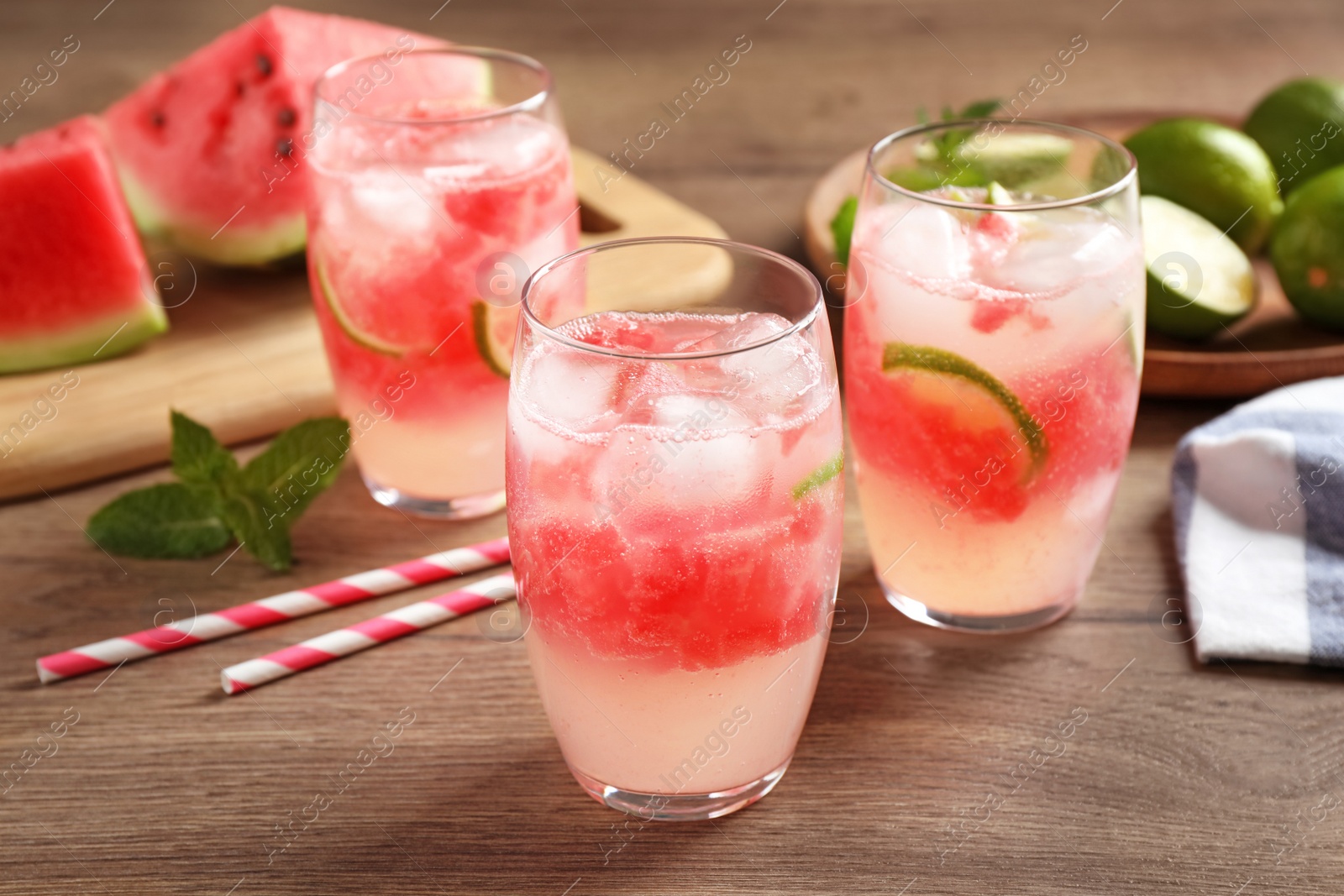 Photo of Delicious refreshing watermelon drink on wooden table