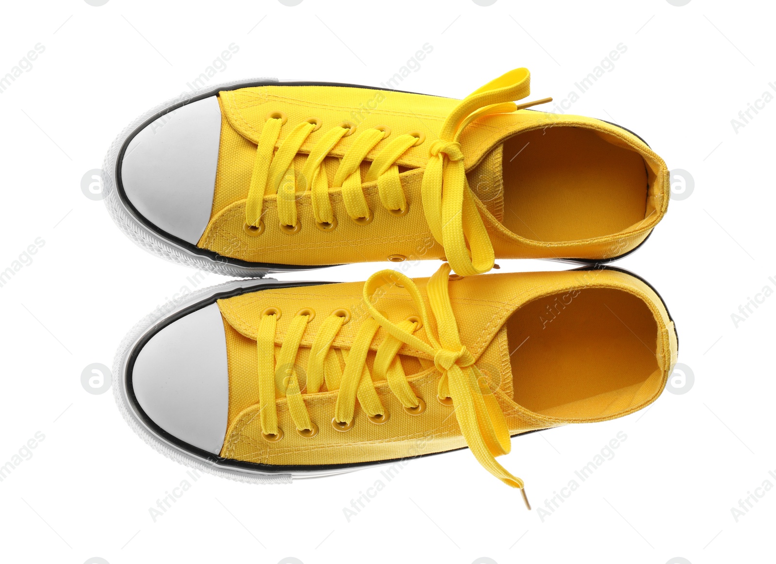 Photo of Pair of trendy sneakers isolated on white, top view