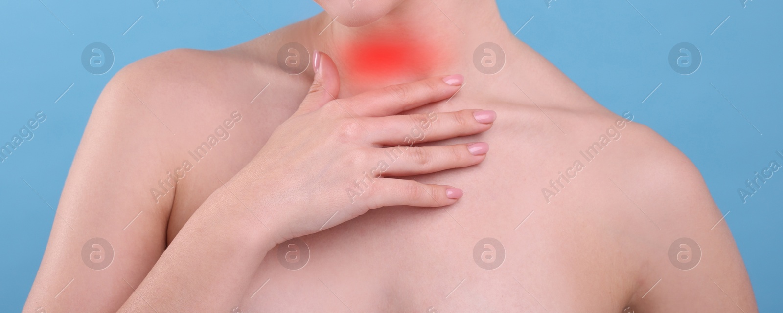 Image of Endocrine system. Woman suffering from pain in thyroid gland on light blue background, closeup. Banner design