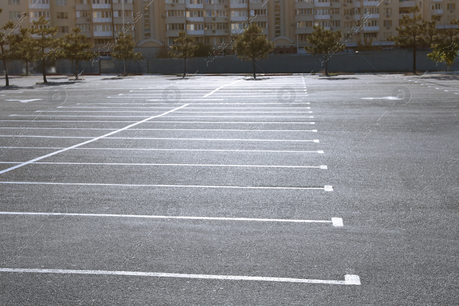 Photo of Car parking lot with white marking outdoors