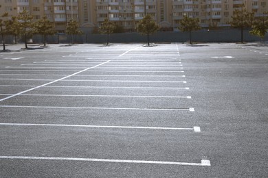 Car parking lot with white marking outdoors