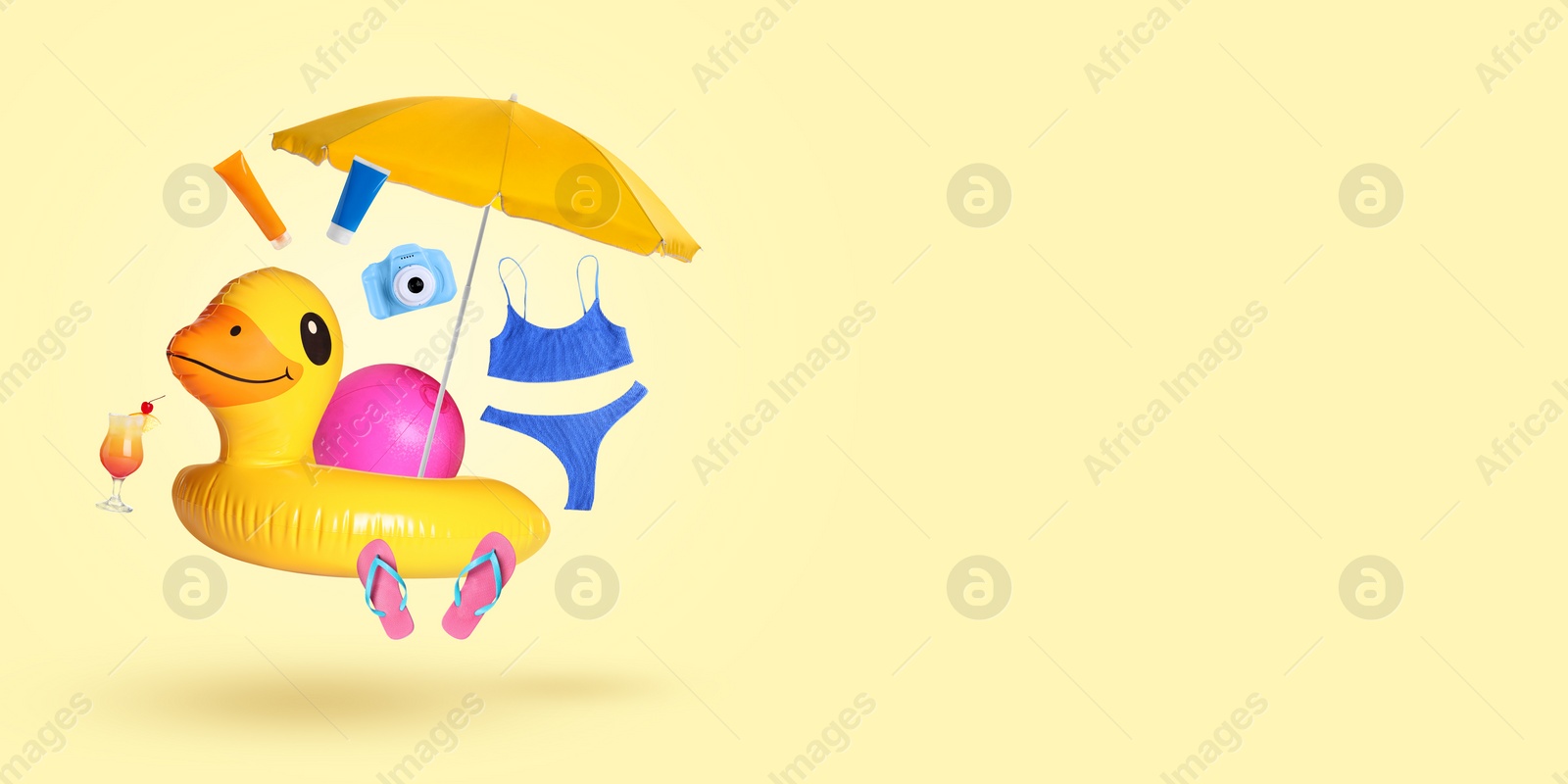 Image of Cocktail and beach accessories flying on beige background. Banner design with space for text