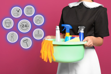 Image of Young chambermaid and different icons on pink background, closeup 