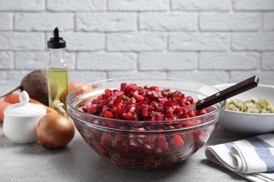 Photo of Delicious fresh vinaigrette salad on light grey table