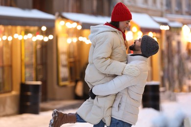 Photo of Lovely couple spending time together on city street