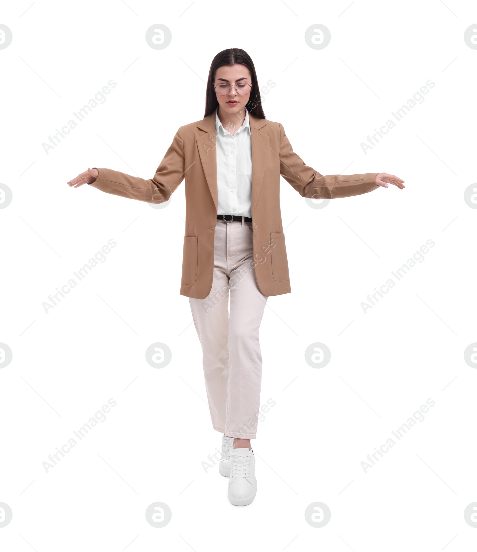 Photo of Beautiful businesswoman with glasses walking on white background