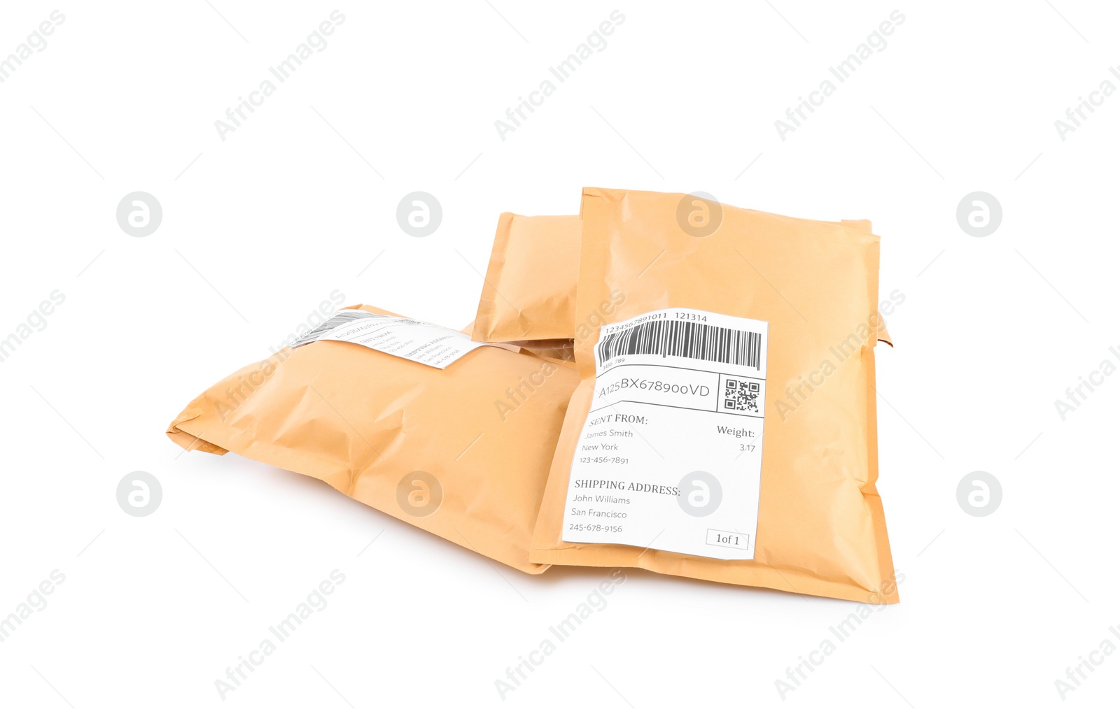 Photo of Padded envelopes on white background. Parcel delivery