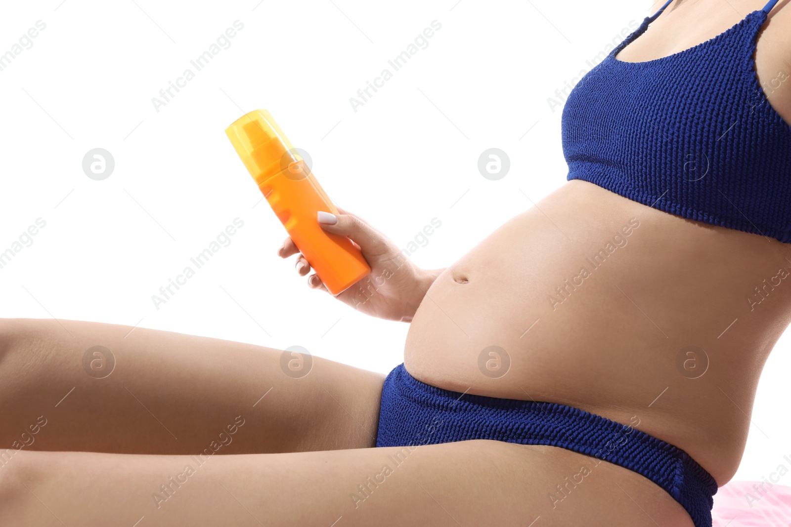 Photo of Pregnant woman with sun protection cream on white background, closeup