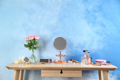 Photo of Dressing table with beauty accessories in room. Space for text