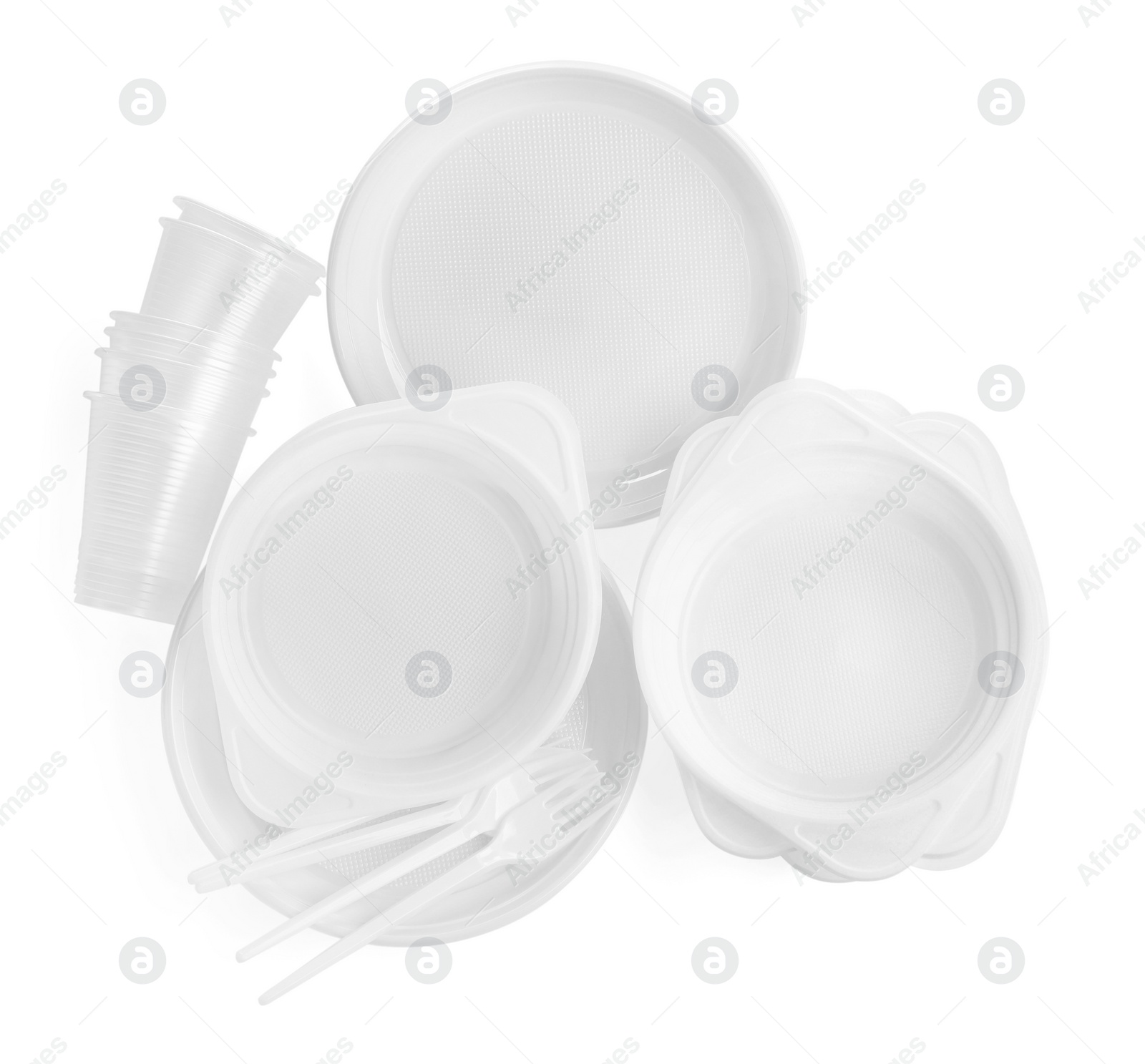 Photo of Set of disposable tableware on white background, top view