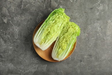 Photo of Plate with fresh sliced cabbage on table, top view