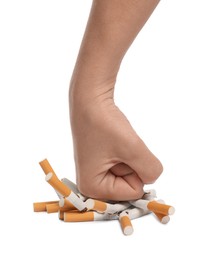 Stop smoking. Man crushing cigarettes on white background, closeup