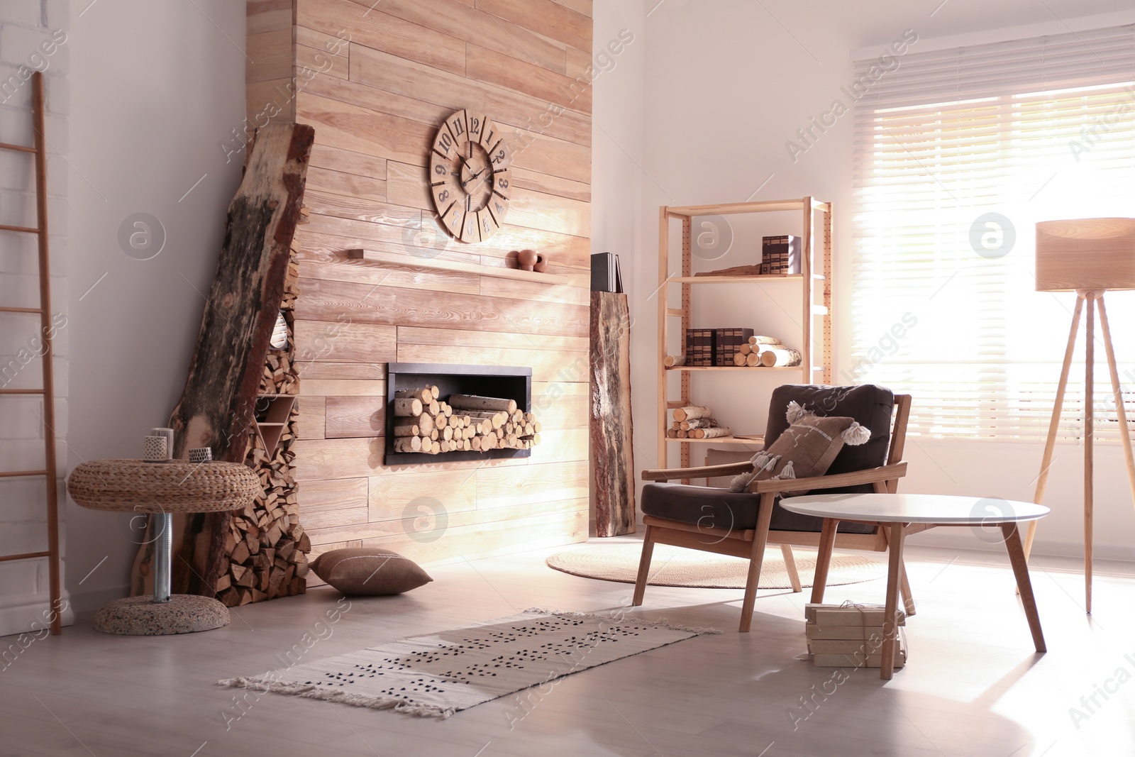 Photo of Decorative fireplace with stacked wood in cozy living room interior