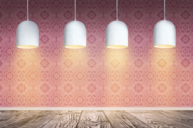 Pink patterned wallpaper and glowing hanging lamps in room