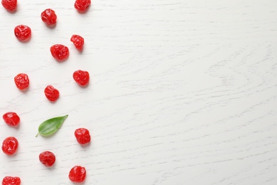 Photo of Tasty cherries on wooden background, flat lay with space for text. Dried fruits as healthy food